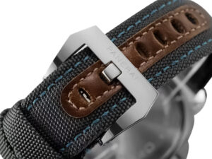 Close-up of the Luminor Base 44 Logo 3 Days Acciaio ‘Blue OP’ watch buckle with dark textile strap and brown leather detail.