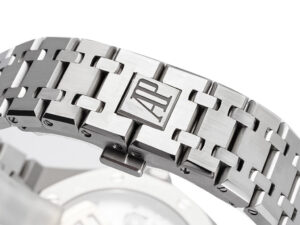 Close-up of the Royal Oak Stainless Steel bracelet with signature "AP" logo engraving, showcasing intricate craftsmanship.