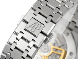 Close-up of the Royal Oak Stainless Steel bracelet showcasing the AP logo and partial view of the watch's mechanism.