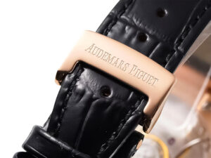 Close-up of the black leather strap and pink gold clasp engraved with "Audemars Piguet" Royal Oak 50th Anniversary watch.