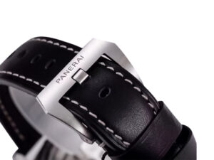 Close-up of the black strap with white stitching and stainless steel buckle engraved with "Panerai" on Luminor 1950 watch.
