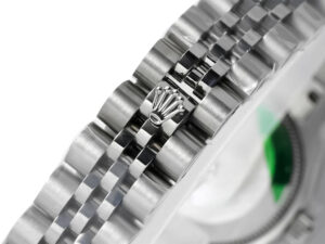 Close-up of the Jubilee bracelet clasp with Rolex crown emblem of Lady-Datejust 28 Stainless Steel with Fluted Bezel.
