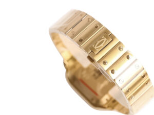 Close-up view of the Santos Large Yellow Gold (40mm) bracelet showcasing its polished gold finish and iconic screw details.