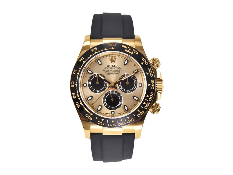Cosmograph Daytona Yellow Gold Oysterflex watch with champagne dial, black bezel, and black rubber strap on white background.