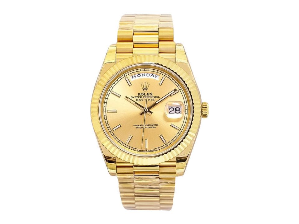 Day-Date 40 Yellow Gold 'President' watch with champagne dial, fluted bezel, and gold bracelet on product display.