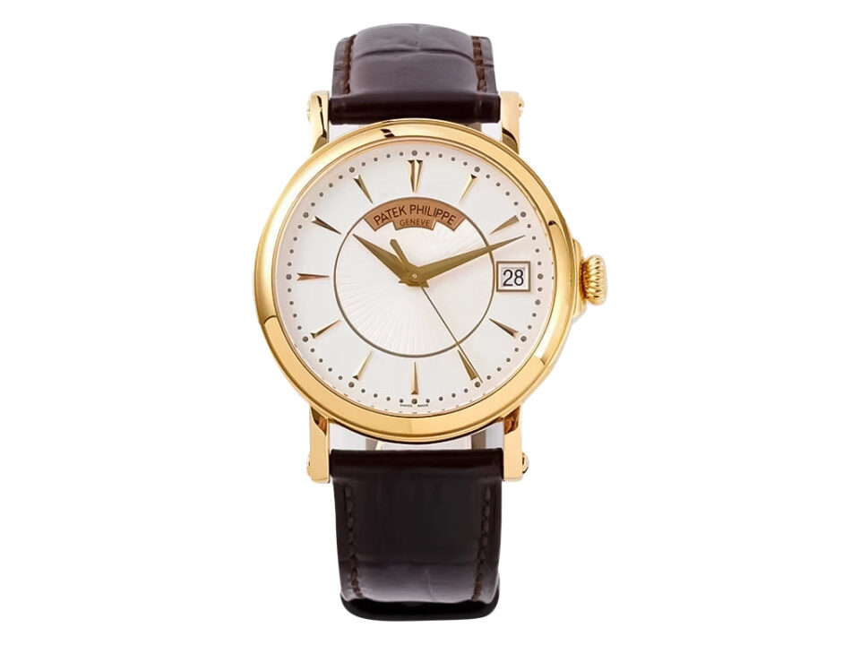 Calatrava Yellow Gold watch with 38mm silver guilloche dial, brown leather strap, and date display at 3 o'clock position.