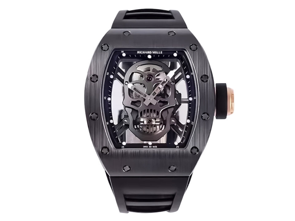 RM 52-01 Skull watch with black dial, rose gold bezel, and black rubber strap, featuring a skull design and tourbillon.