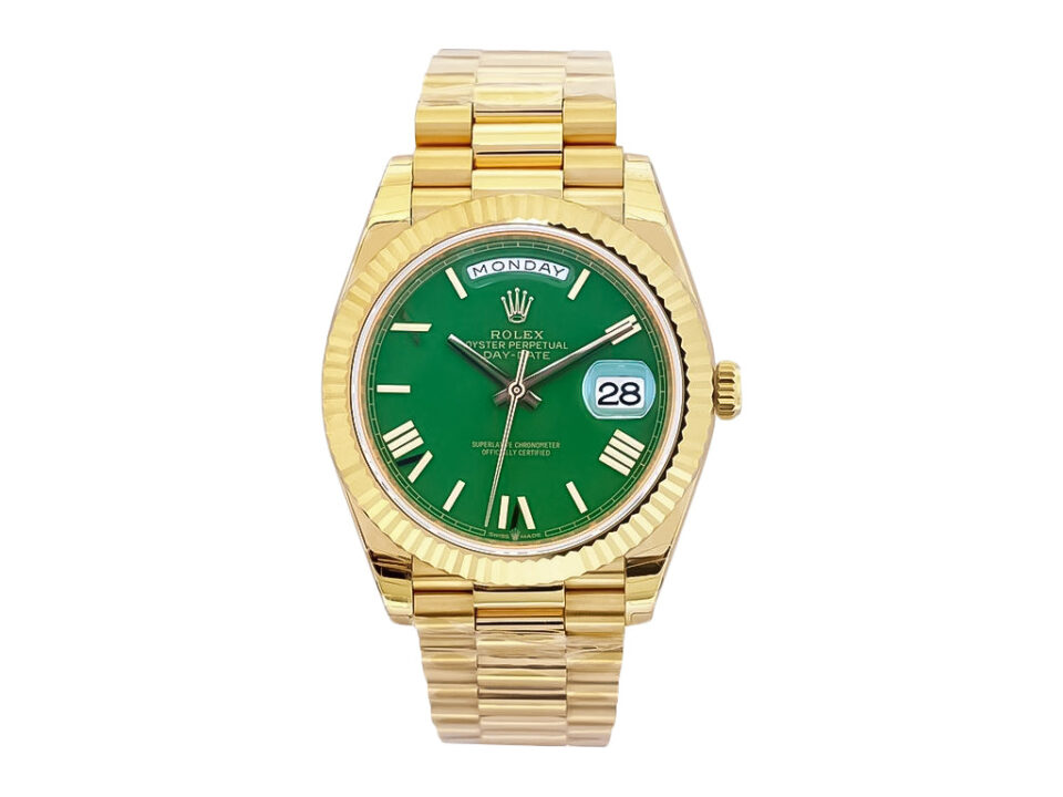 Day-Date 40 Yellow Gold ‘President’ watch with green dial, Roman numerals, and fluted bezel.