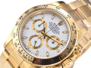 Close-up view of Cosmograph Daytona Yellow Gold watch featuring a white dial with gold accents and a yellow gold bracelet.