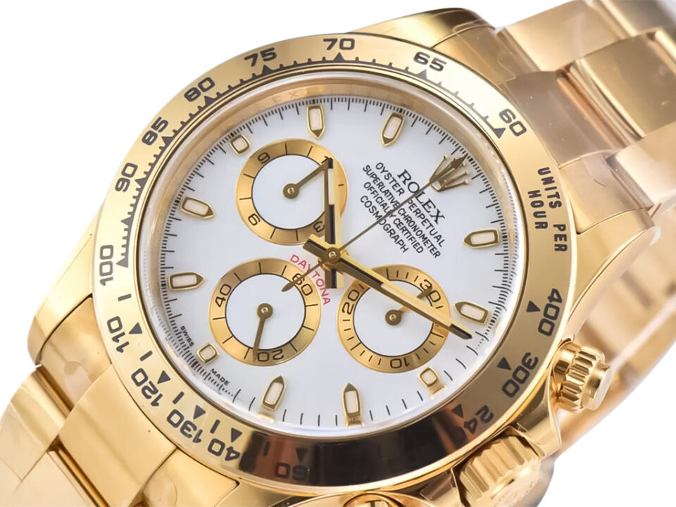 Close-up view of Cosmograph Daytona Yellow Gold watch featuring a white dial with gold accents and a yellow gold bracelet.