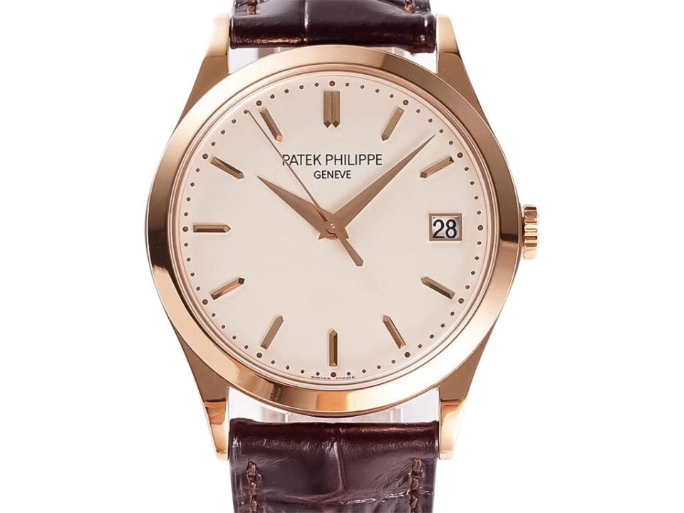 Calatrava Rose Gold watch ivory dial (38mm) featuring brown leather strap, minimal hour markers, date display at 3 o'clock.