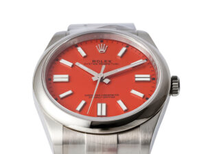 Oyster Perpetual 41 Stainless Steel watch with a vibrant red dial, silver hour markers, and a sleek metal bracelet.