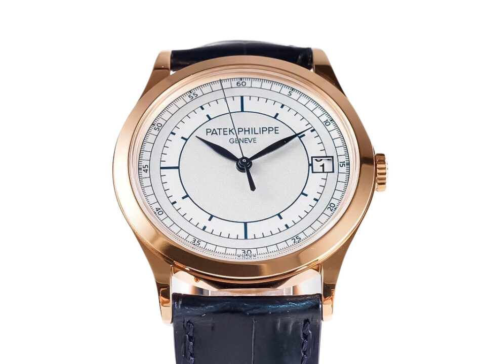 Calatrava Rose Gold 'Scientific' watch with 38mm silver dial, blue leather strap, and date display at 3 o'clock position.