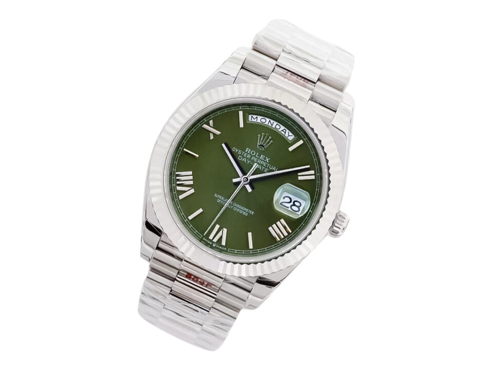 Day-Date 40 White Gold ‘President’ watch with green dial, Roman numerals, fluted bezel, and a polished bracelet.