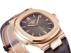 Rose gold Nautilus watch with chocolate dial, leather strap, and a 40mm case displayed at an angle on a white background.