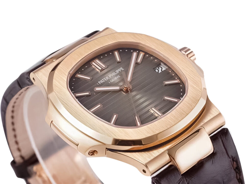 Rose gold Nautilus watch with chocolate dial, leather strap, and a 40mm case displayed at an angle on a white background.