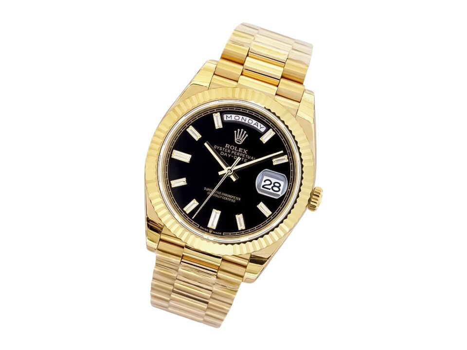 Day-Date 40 Yellow Gold ‘President’ watch with Onyx Diamond Dial, Fluted Bezel, and gold link bracelet.