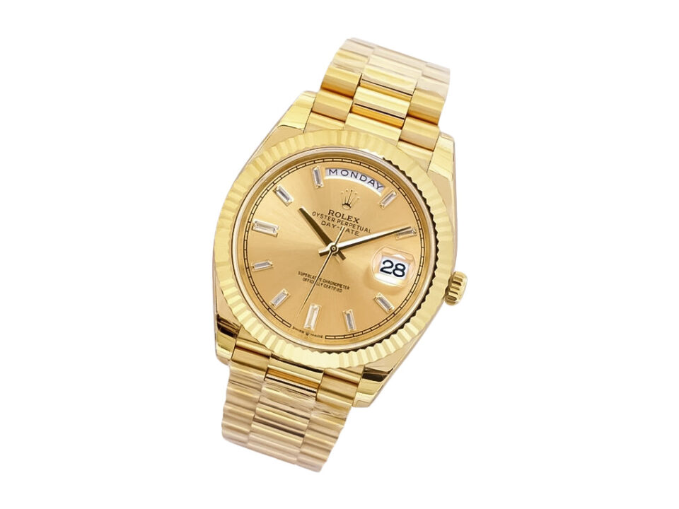 Day-Date 40 Yellow Gold ‘President’ with Champagne Diamond Dial, Fluted Bezel, and signature gold bracelet.