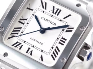 Close-up of the Santos Medium Stainless Steel watch with a white dial, Roman numerals, blue hands, and automatic movement.