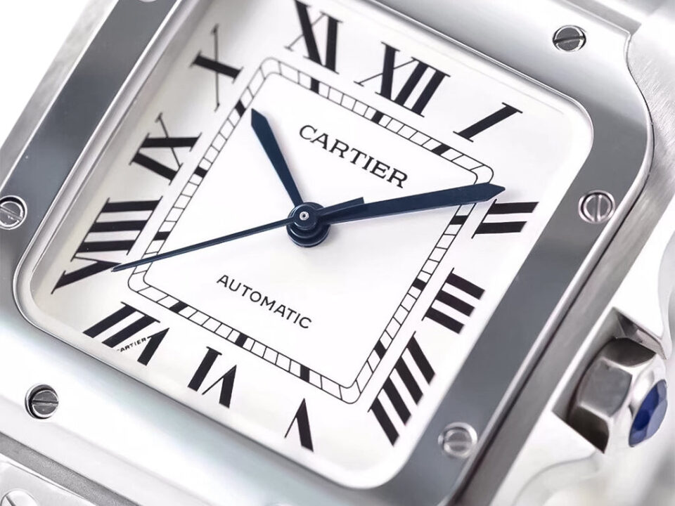 Close-up of the Santos Medium Stainless Steel watch with a white dial, Roman numerals, blue hands, and automatic movement.