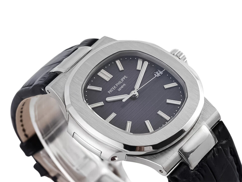 Nautilus Stainless Steel watch with a grey dial, 40mm case, and black leather strap displayed at an angled view.