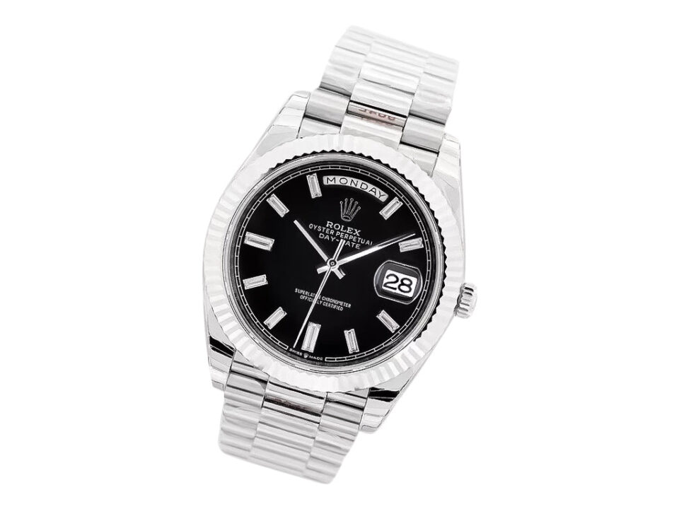 Day-Date 40 White Gold ‘President’ watch with black diamond dial, fluted bezel, and polished bracelet.