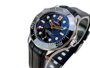 Seamaster Diver 300 'James Bond' watch with a blue dial, rubber strap, and 42mm stainless steel case displayed at an angle.