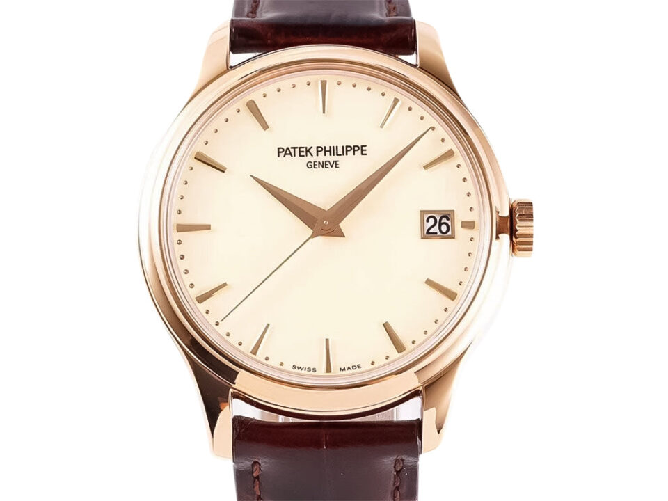 Calatrava Rose Gold with Ivory Dial (39mm) featuring a sleek design, brown leather strap, and date display at 3 o'clock.