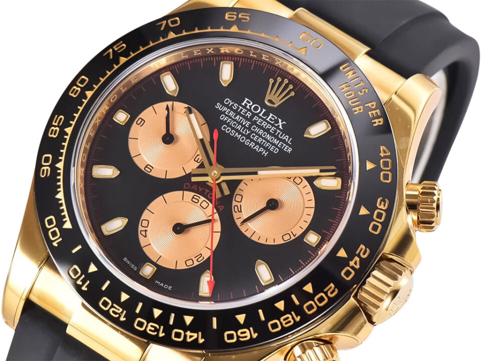 Cosmograph Daytona Yellow Gold Oysterflex watch with black and champagne dial, featuring gold accents and a sleek design.