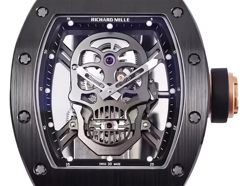 RM 52-01 Skull watch with black dial, rose gold bezel, black rubber strap, and visible tourbillon mechanism (50mm).