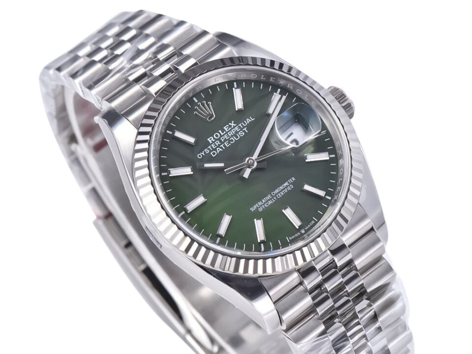 Datejust 36 Stainless Steel on Jubilee with Palm Motif Green Dial, Fluted Bezel, and Cyclops Lens over Date Display.