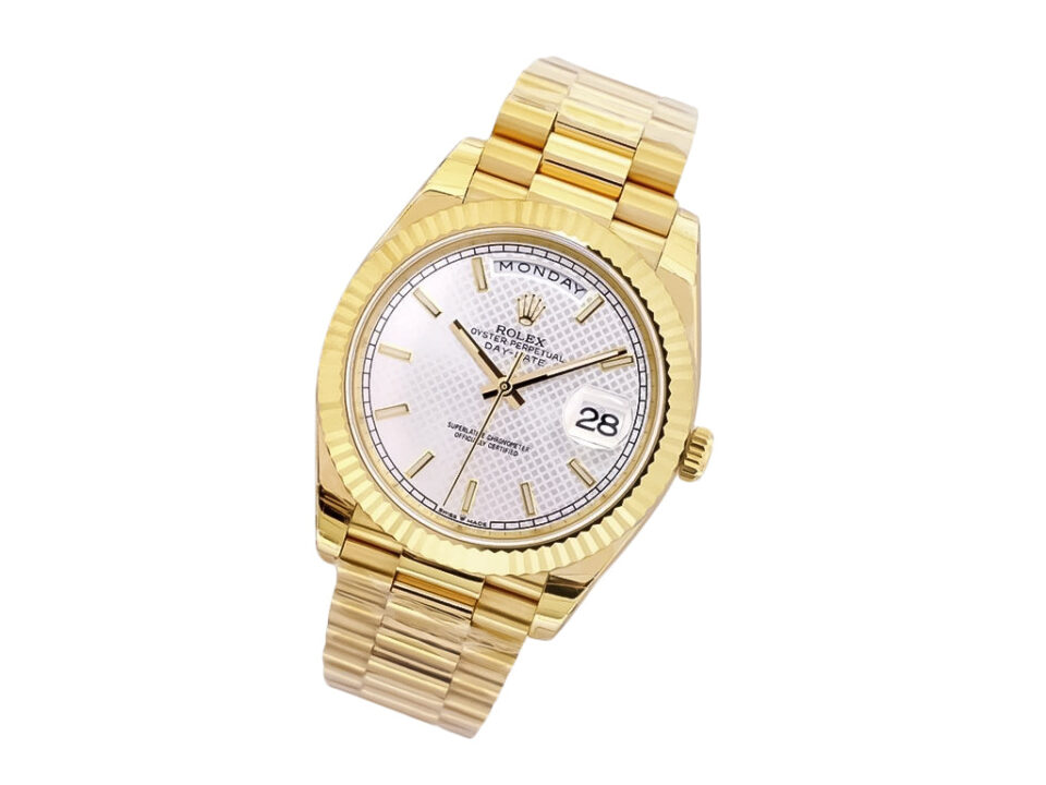 Day-Date 40 Yellow Gold ‘President’ with Silver Motif Dial, Fluted Bezel, and President Bracelet on product display.