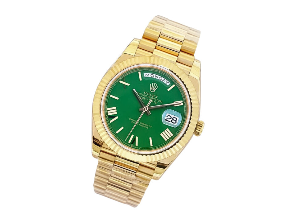 Day-Date 40 Yellow Gold 'President' watch with green dial, Roman numerals, fluted bezel, and gold bracelet.