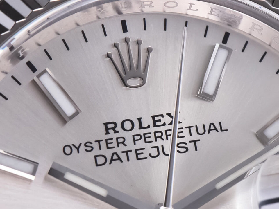 Close-up of the Datejust 36 Stainless Steel watch with Silver Dial, Fluted Bezel, Jubilee bracelet showing logo and markers.