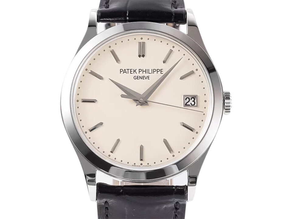 Calatrava Stainless Steel watch with ivory dial (38mm), black leather strap, and date display at the 3 o'clock position.