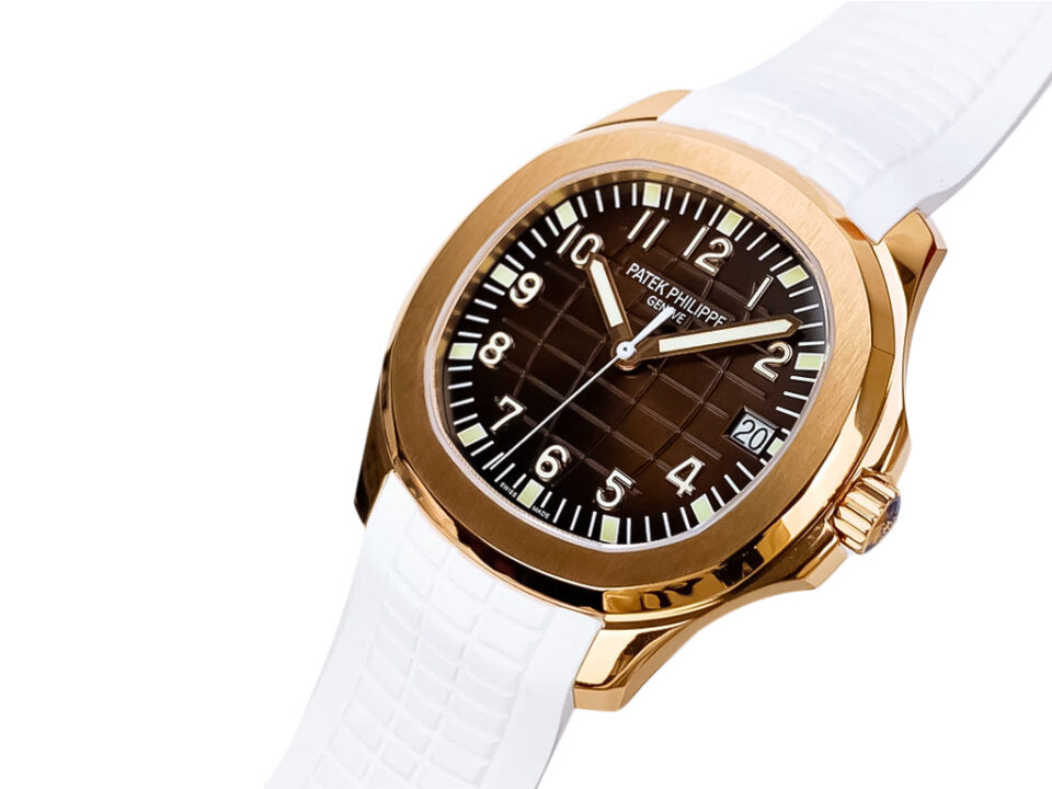 Aquanaut Rose Gold watch with chocolate brown dial, white strap, and 40mm case displayed at an angle.
