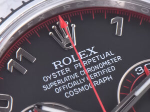 Close-up of the Cosmograph Daytona Stainless Steel Oysterflex watch with Matte Black 'Racing Dial' and red accents.