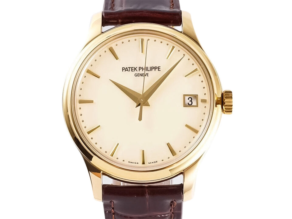 Calatrava Yellow Gold with Ivory Dial (39mm) featuring a sleek design, date display, and brown leather strap.
