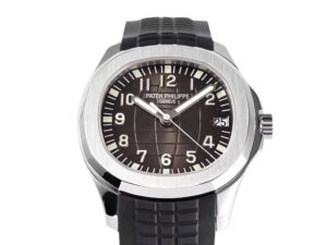 Aquanaut Stainless Steel watch with black embossed dial, 38mm case, silver hands, Arabic numerals, and black rubber strap.