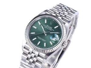 Datejust 36 Stainless Steel on Jubilee bracelet with Mint Green Dial, Fluted Bezel, and date window at 3 o'clock.