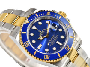Submariner Date 'Two Tone' watch in yellow gold and stainless steel with a blue dial and bezel, displayed at an angle.