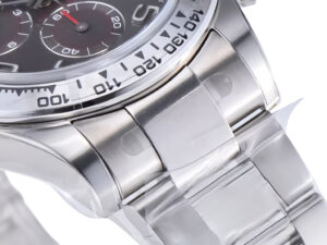 Close-up of the Cosmograph Daytona Stainless Steel watch showcasing grey sunburst dial, Arabic numerals, polished bracelet.