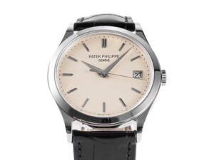 Calatrava Stainless Steel watch with ivory dial (38mm), black leather strap, date display, and minimalist hour markers.