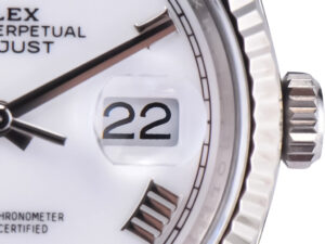 Close-up of the Datejust 36 Stainless Steel watch with white Roman numeral dial, fluted bezel, and date displayed as "22".