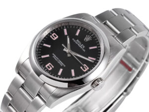 Oyster Perpetual 36 Stainless Steel watch with a black dial, pink Arabic numeral indices, and a sleek metallic bracelet.