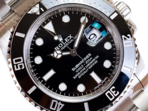 Submariner Date Stainless Steel watch with black dial, 40mm case, ceramic bezel, and luminescent hour markers.