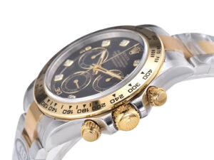 Two-tone yellow gold and steel Cosmograph Daytona watch with a diamond black dial, showcasing elegant craftsmanship.