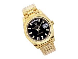 Day-Date 40 Yellow Gold ‘President’ watch with Onyx Diamond Dial, Fluted Bezel, and date display at 3 o'clock.