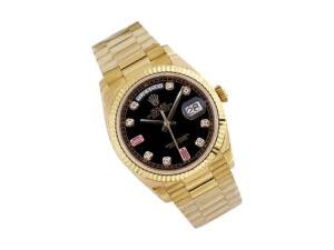 Day-Date 36 Stainless Steel ‘President’ watch with silver dial, diamond bezel, and gold bracelet displayed.