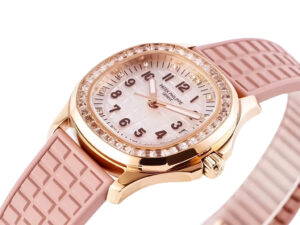 Rose gold watch with diamond bezel, pink strap, and mother-of-pearl dial displayed on the product page for Aquanaut Luce.